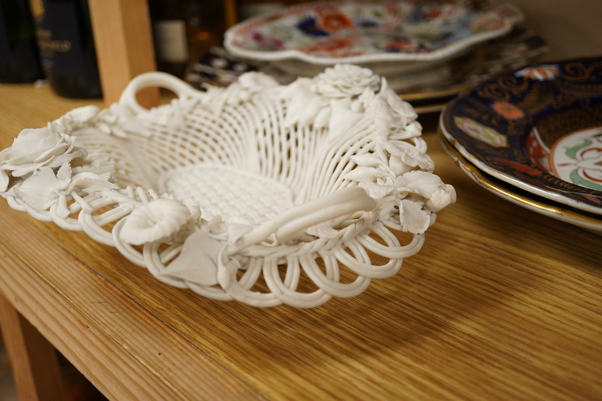 A Belleek porcelain basket, two Masons Ironstone dishes, a pair of Royal Crown Derby Japan pattern dishes and an ironstone leaf shaped dish (6).